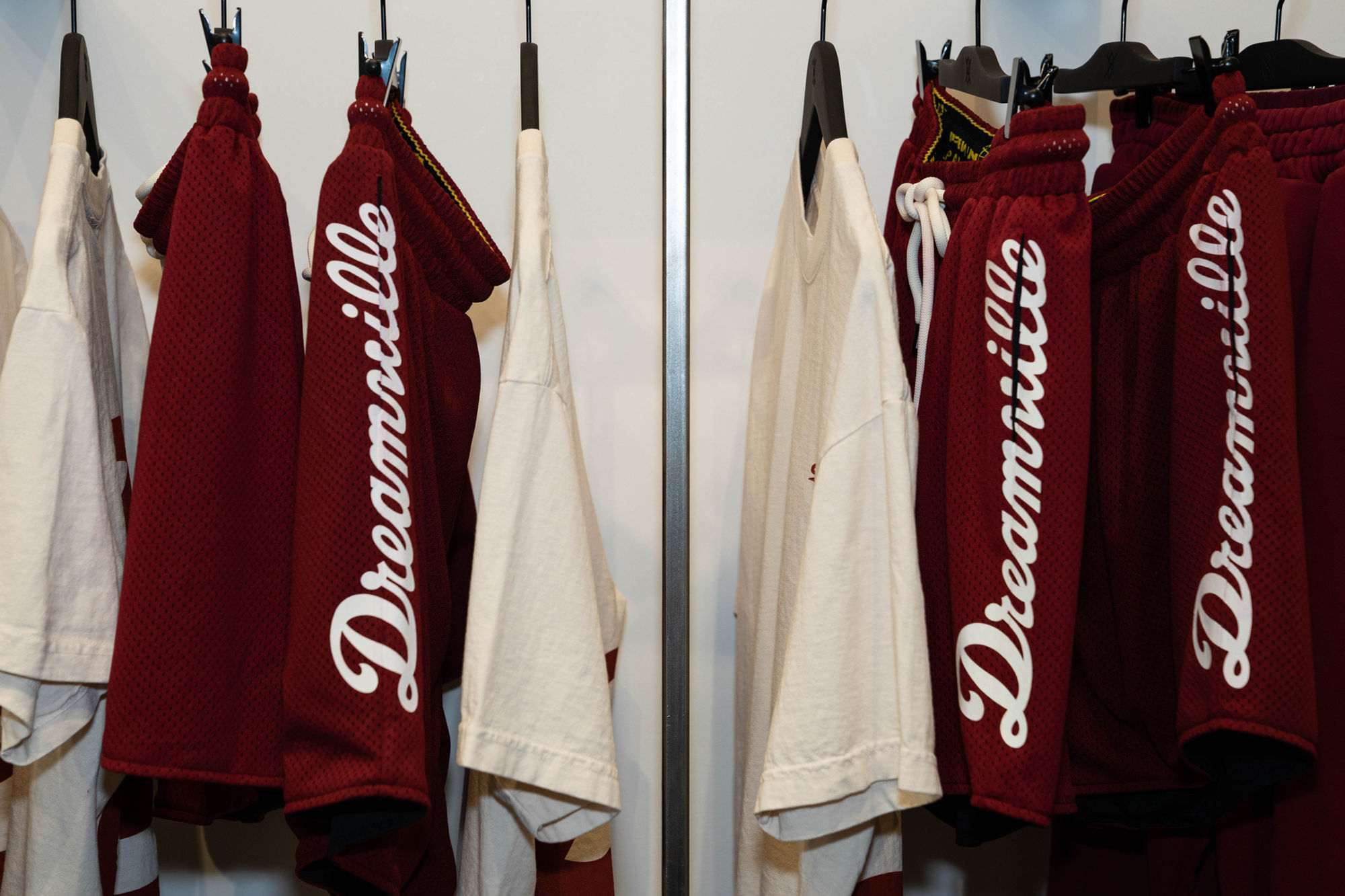 Dream Daily capsule pieces on the rack, Daily Paper × Dreamville branding detail