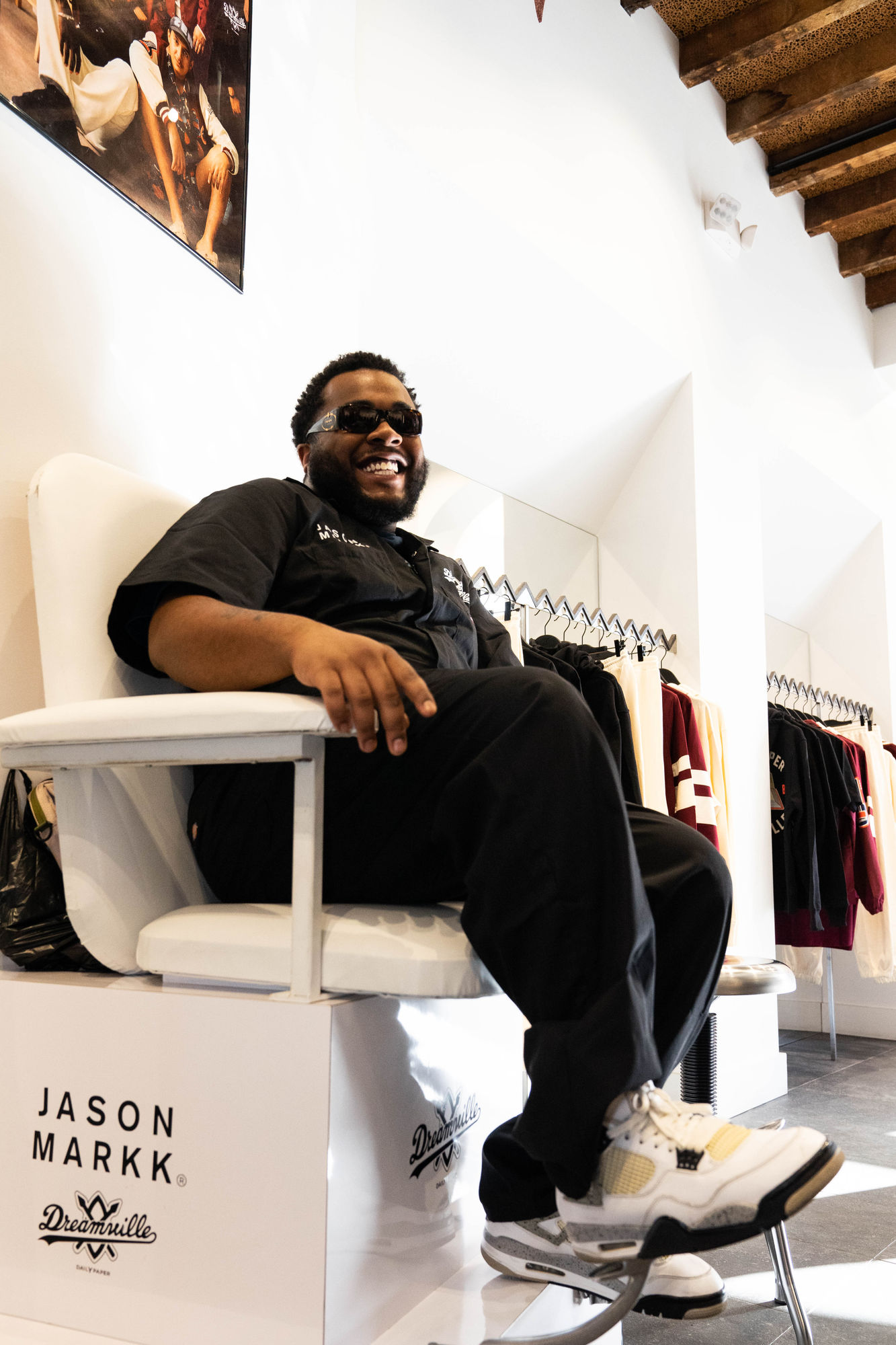 A guest laughing in the Jason Markk shoeshine chair at the Dream Daily launch
