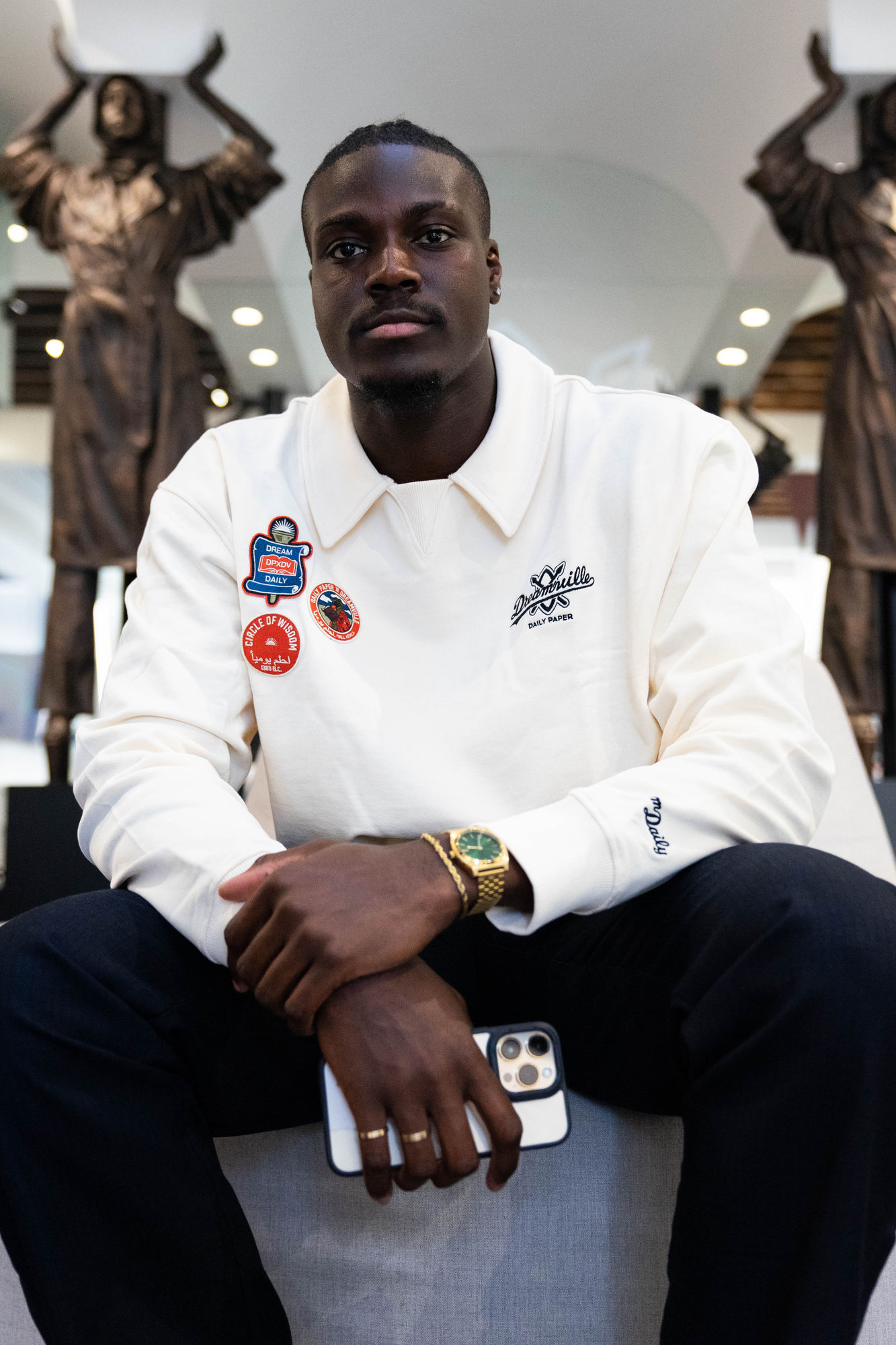 Portrait of a guest wearing Dream Daily patches inside Daily Paper’s New York flagship