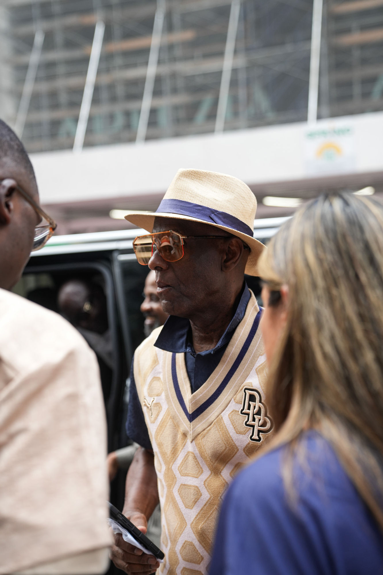 Dapper Dan in conversation with guests on the street at the PUMA launch