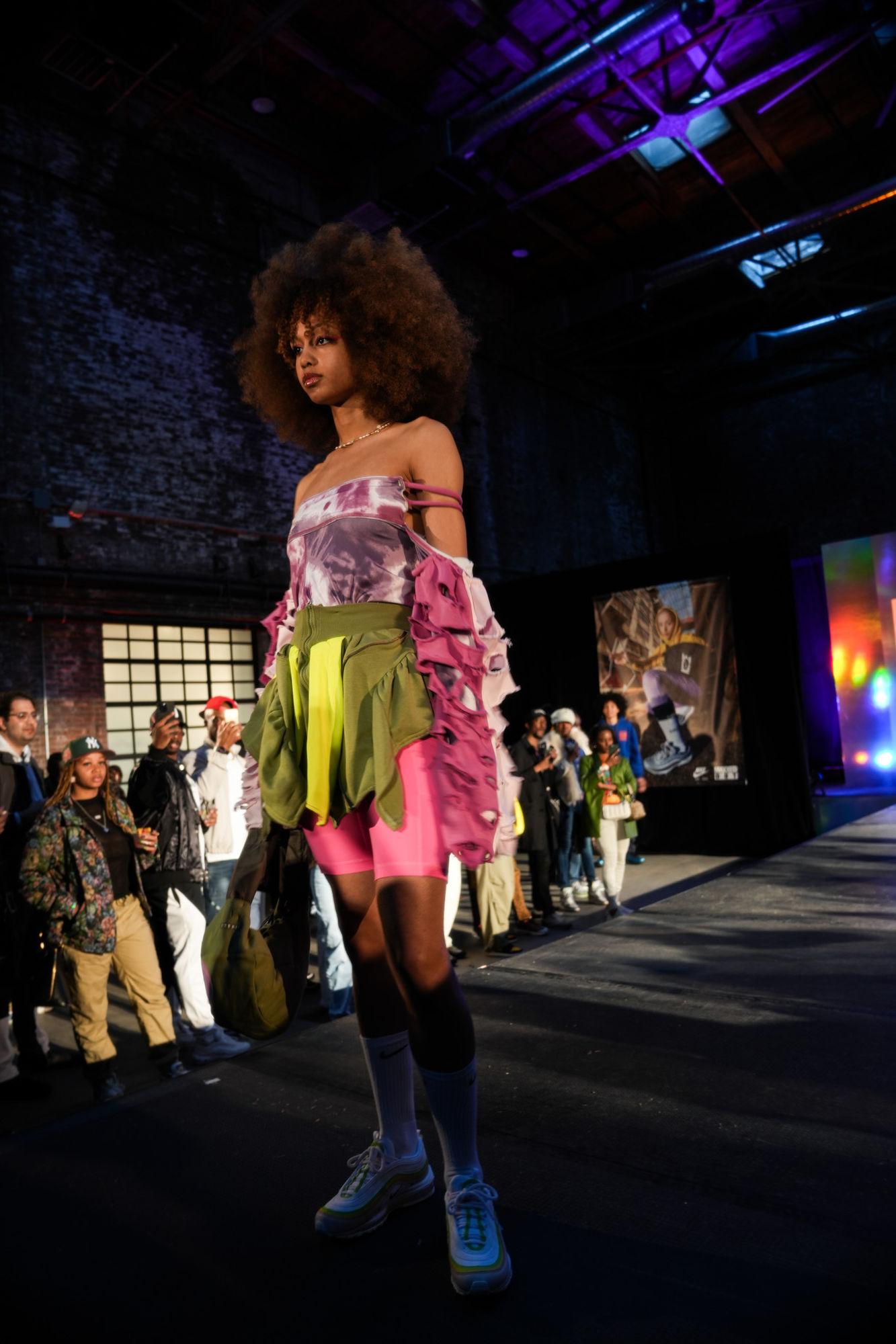 Runway model in an afro and pink-and-green look at Air Max Day