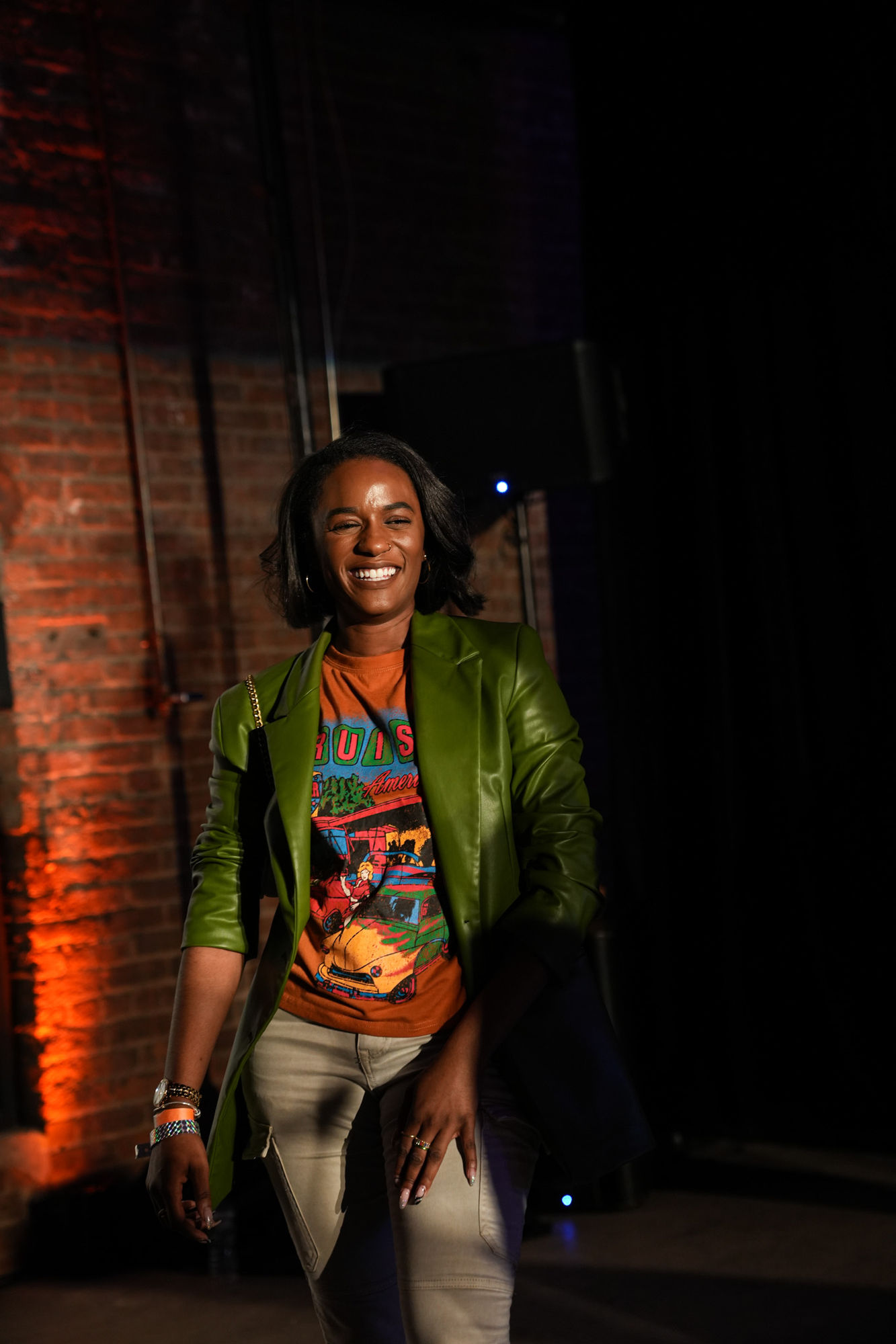 Guest portrait in a green leather blazer at the Air Max Day afterparty