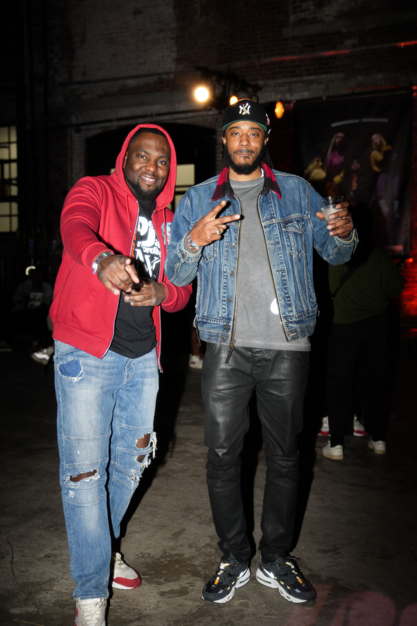 Two guests posing together at the Air Max Day afterparty